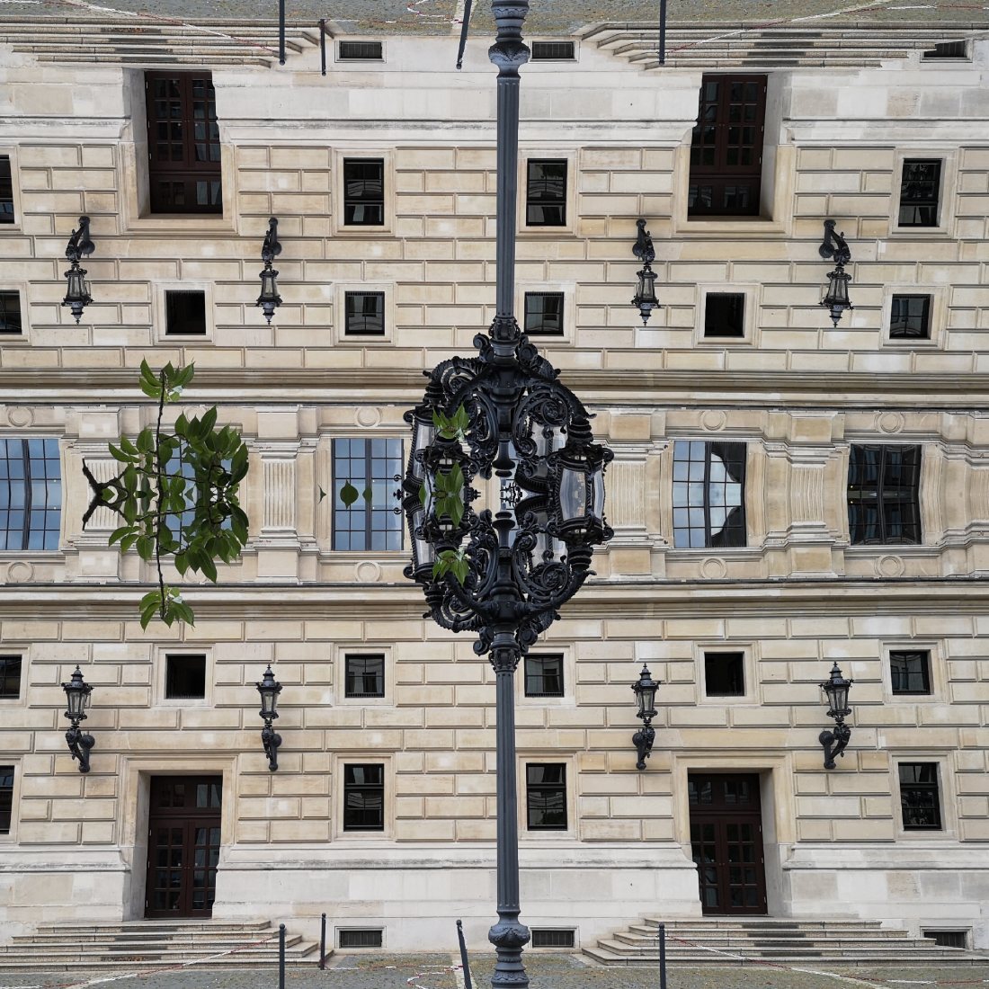A Frankfurt facade with a street lamp: mirrored